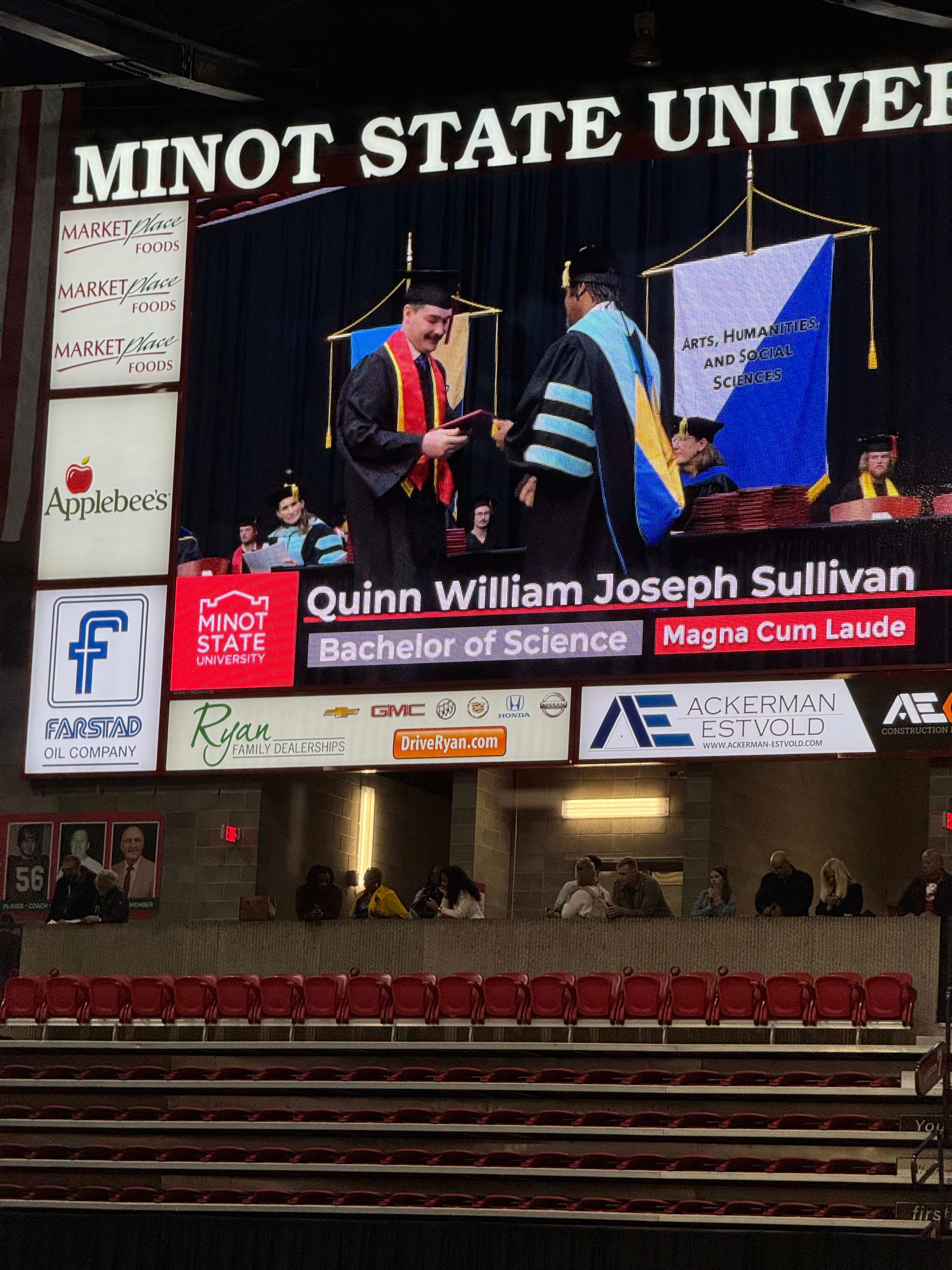 Quinn Walking Across the Stage