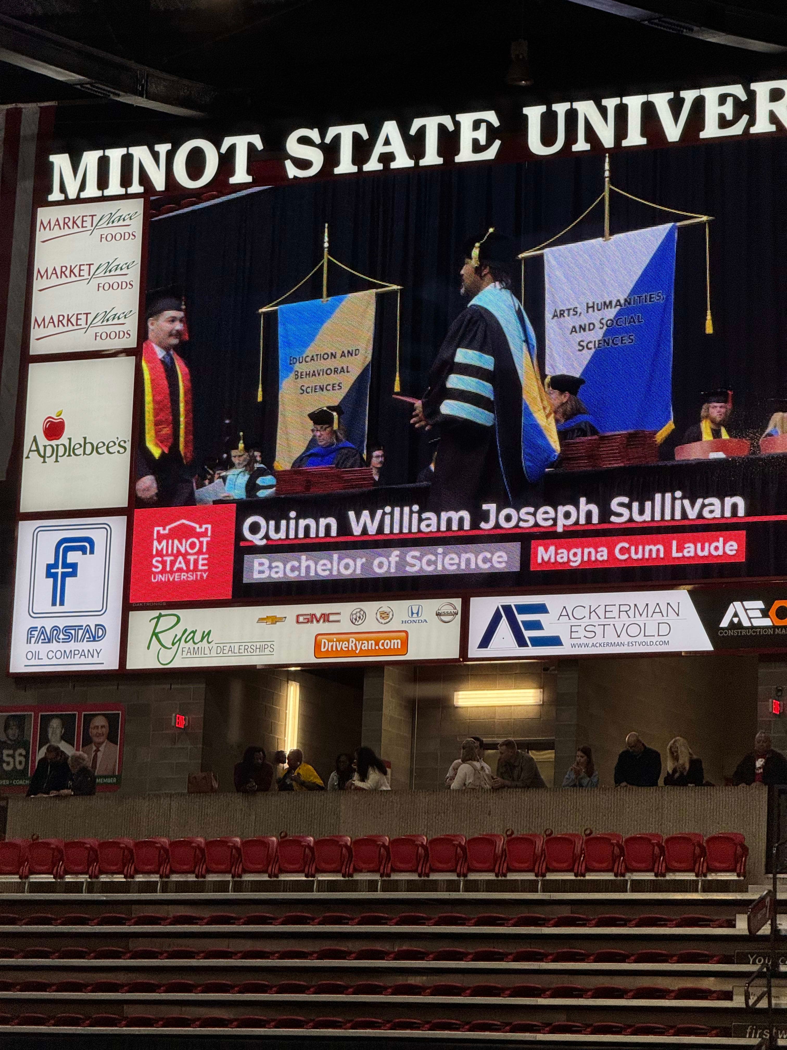 Quinn Walking Across the Stage